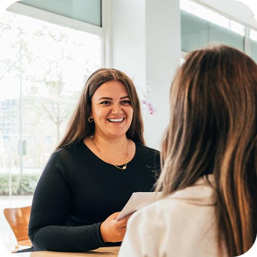Hospitality - Receptionist talking to patient rounded corners